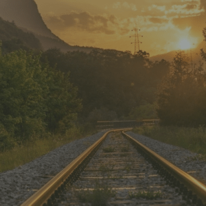 A train track, with trees and sunset in the background - a possible inspiration location