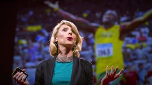 Amy Cuddy presenting her TED talk on how your body language may shape who you are