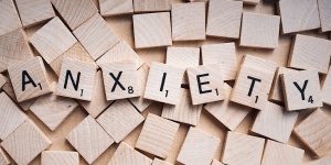 Scrabble pieces spelling out the word 'anxiety'